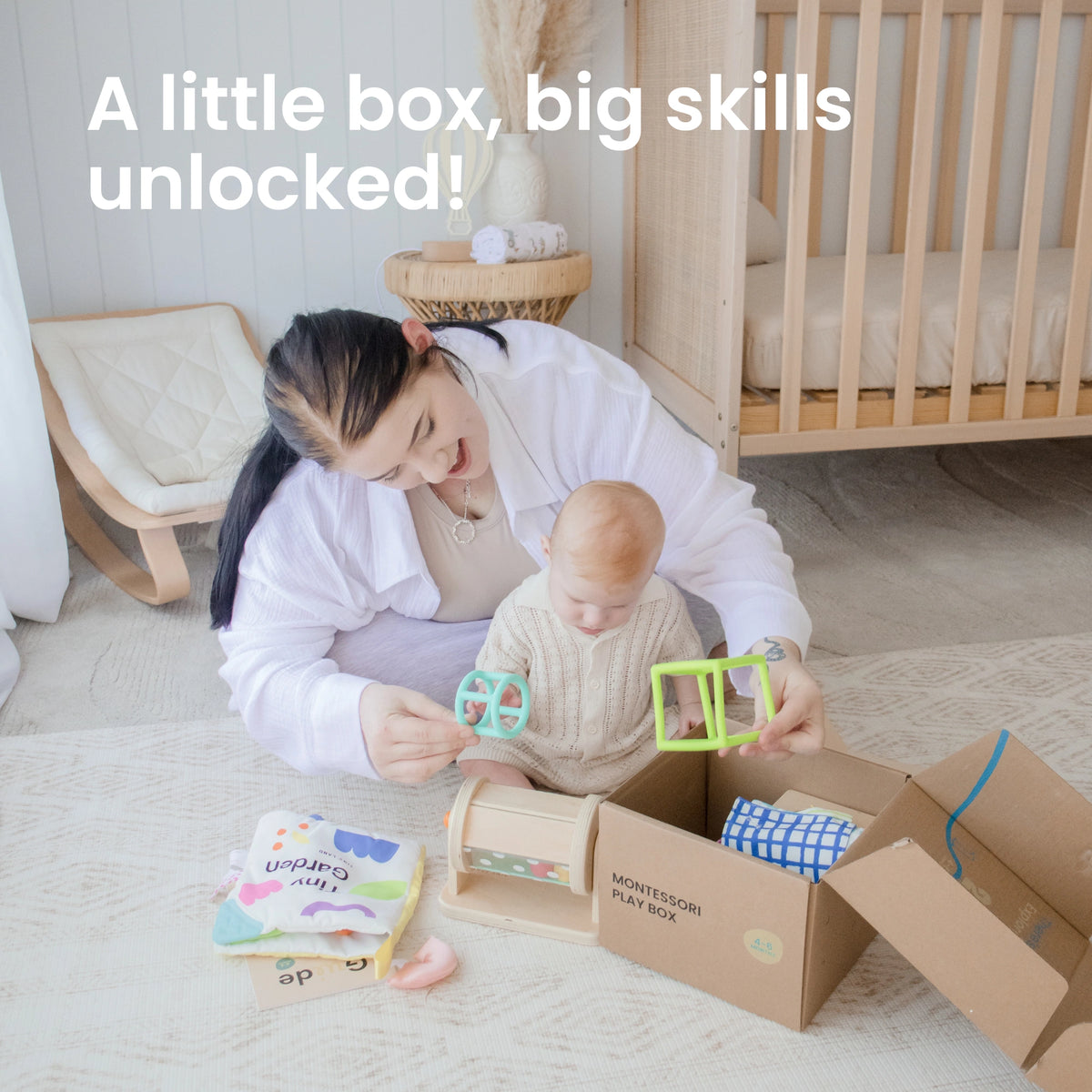 A woman and baby explore Tiny Land® Montessori Toys for Newborns (4–6 Months) on a soft rug in a cozy nursery. Text: "A little box, big skills unlocked!"—perfect for building fine motor skills and encouraging discovery.